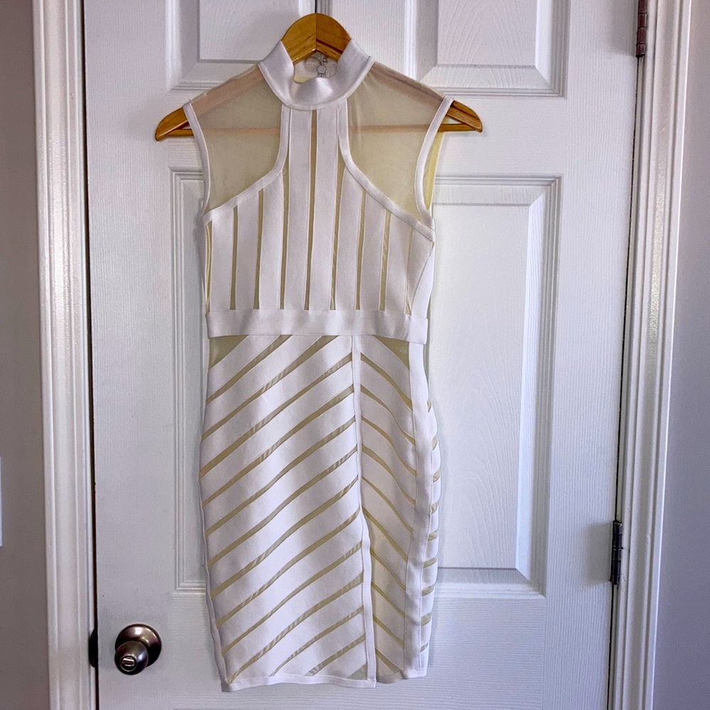 White dress with a split on the side dress from kira kira size is a small